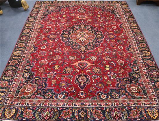 A Meshed red ground carpet, 10ft 6in by 7ft 6in.